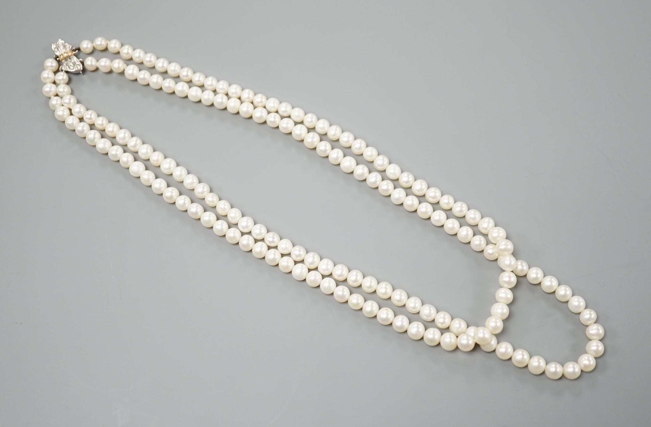 A Portuguese double strand cultured pearl necklace, with diamond set 800 finesse white metal clasp, 23.5cm.